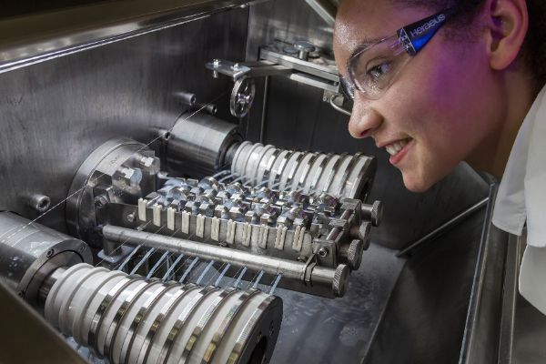 Emloyee at fine wire drawing machine