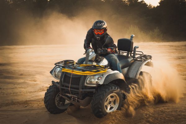 Quad driving in the sand